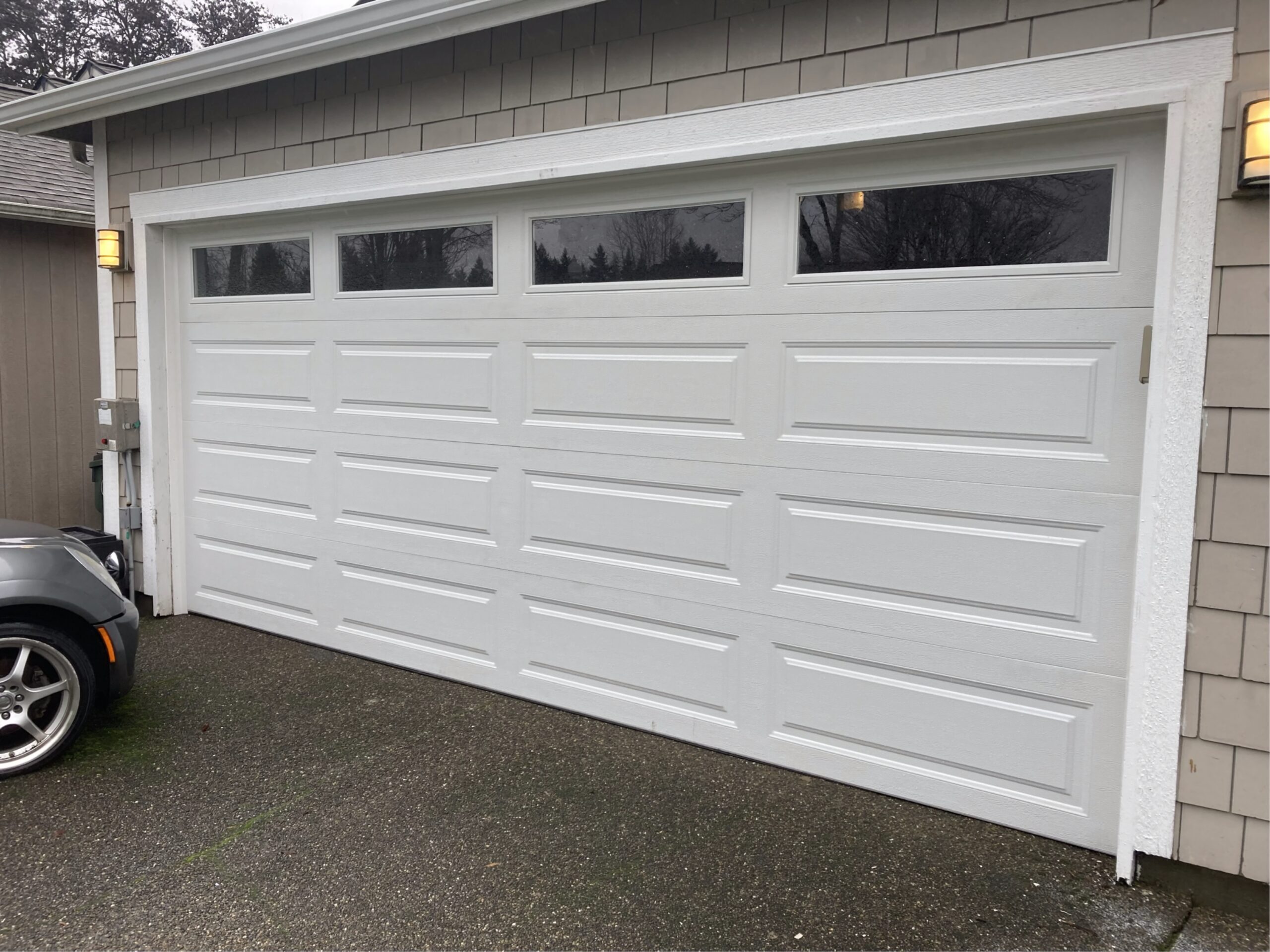 Insulated garage door installation Olympia WA Clopay 4053 16x7 with windows