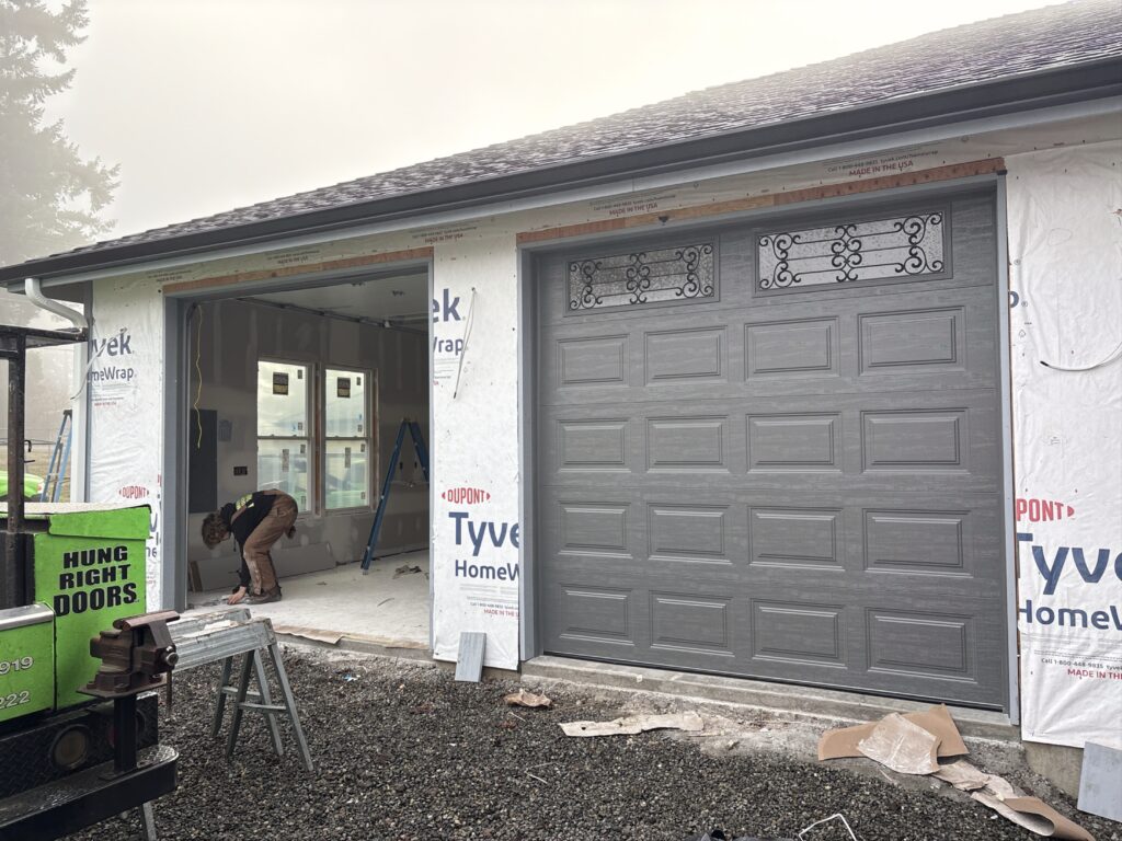 Garage door repair Olympia WA technician fixing residential garage door