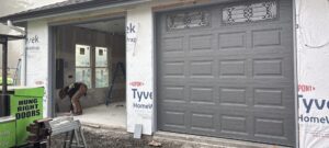 Garage door repair Olympia WA technician fixing residential garage door